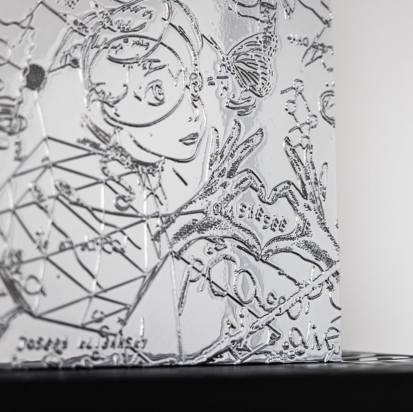 A detail close up of a chrome painting collectable art collectable by Joseph Klibansky
