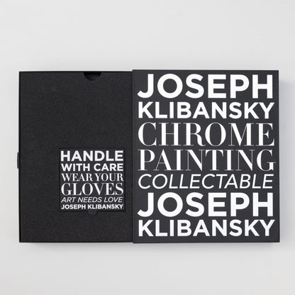 Joseph Klibansky Chrome Painting Collector's Box. A black box with chrome foil silver text in open position. Showing the small gloves box